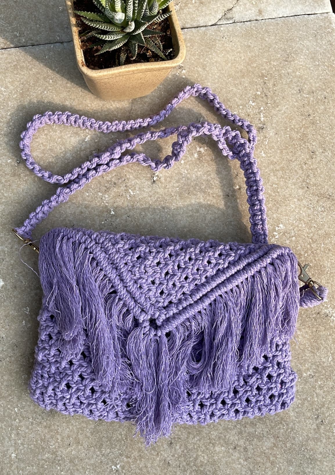 Handmade macramé bag in purple cord